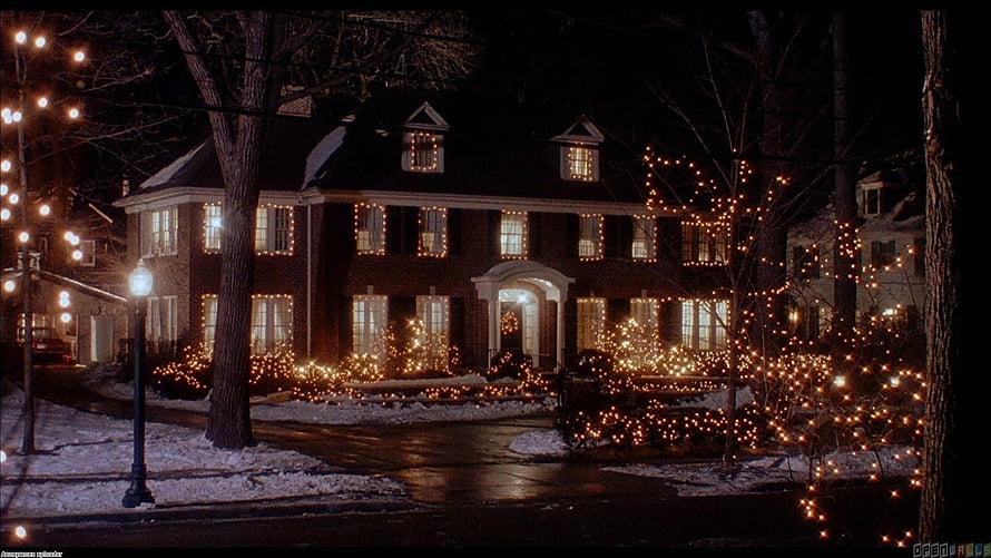 Home Alone Christmas House with Warm String Lights and Snowy Night Scene HD wallpaper