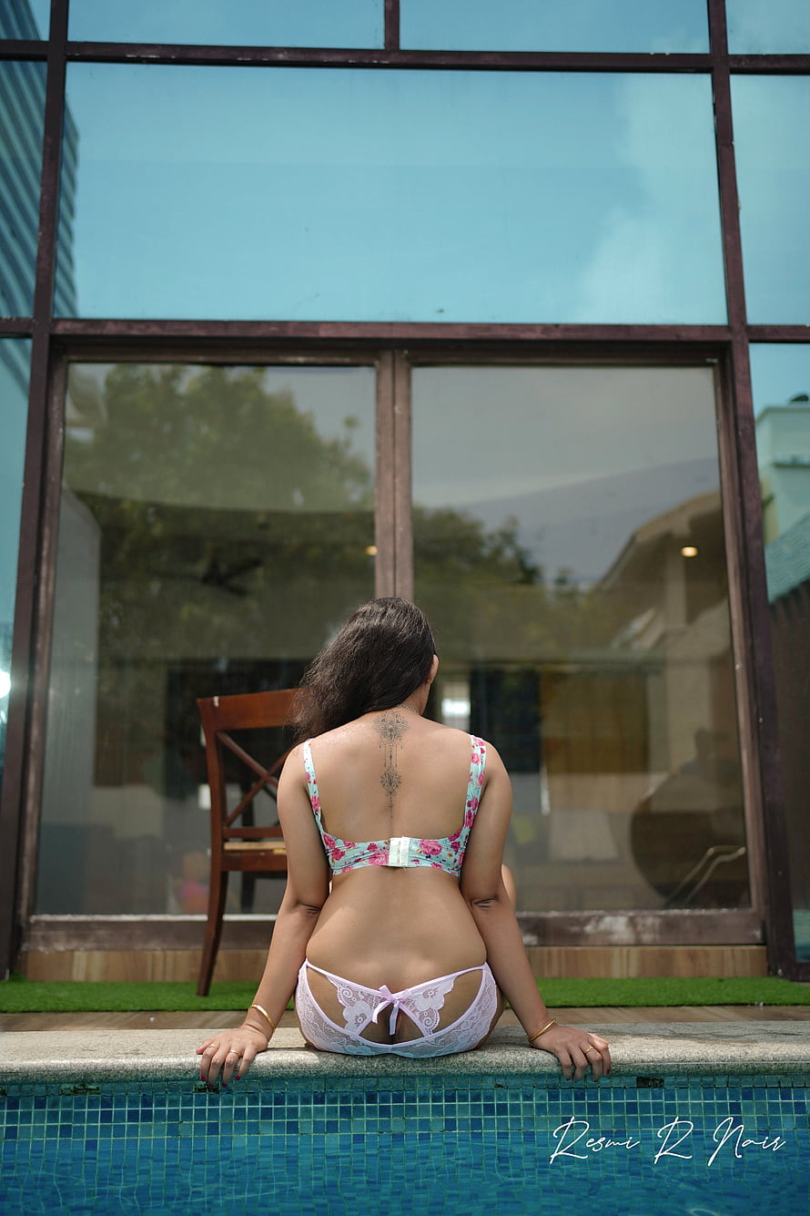 Woman in Floral Bikini Sitting by Poolside with Back Tattoo, Resmi R Nair []: Latest , Stills of Resmi R Nair HD phone wallpaper