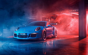 Blue Porsche 911 Turbo S in Neon-Lit Industrial Garage with Dramatic Smoke and Reflections HD wallpaper