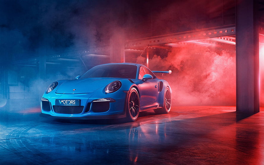 Blue Porsche 911 Turbo S in Neon-Lit Industrial Garage with Dramatic Smoke and Reflections HD wallpaper