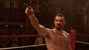 Yuri Boyka Pointing in Underground Boxing Ring with Bloodied Face and Tattoos HD wallpaper