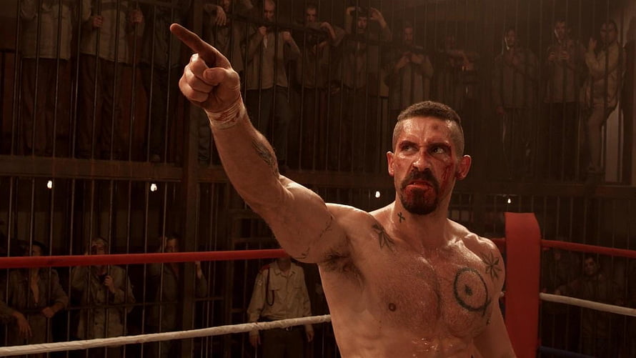Yuri Boyka Pointing in Underground Boxing Ring with Bloodied Face and Tattoos HD wallpaper