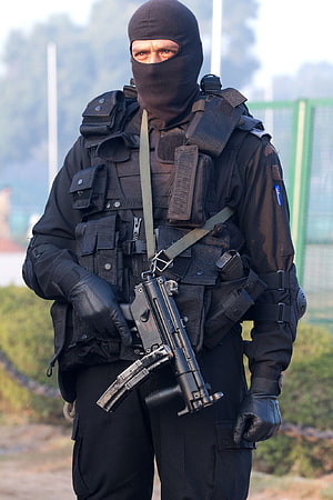 Indian NSG Commando in Full Tactical Gear Holding an Assault Rifle HD phone wallpaper