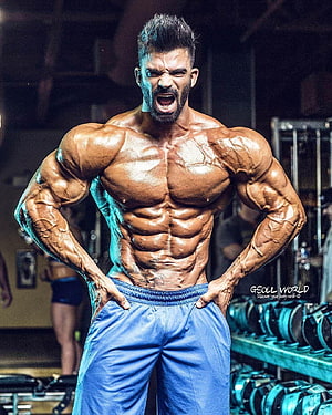 Sergi Constance Bodybuilder Flexing in Gym with Intense Expression and Defined Muscles HD phone wallpaper