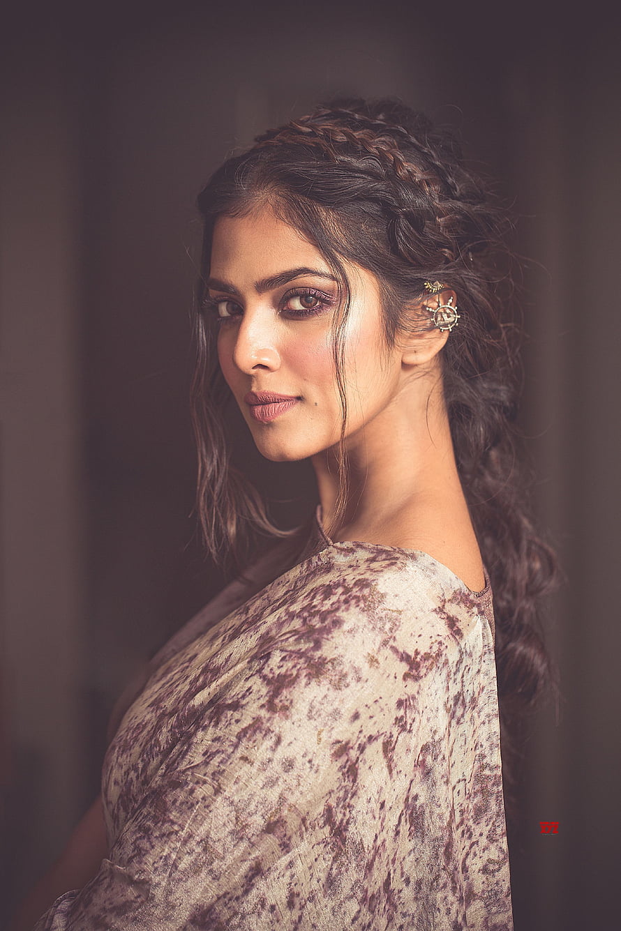 Malavika Mohanan in Traditional Attire with Intricate Braided Hair and Elegant Earrings HD phone wallpaper