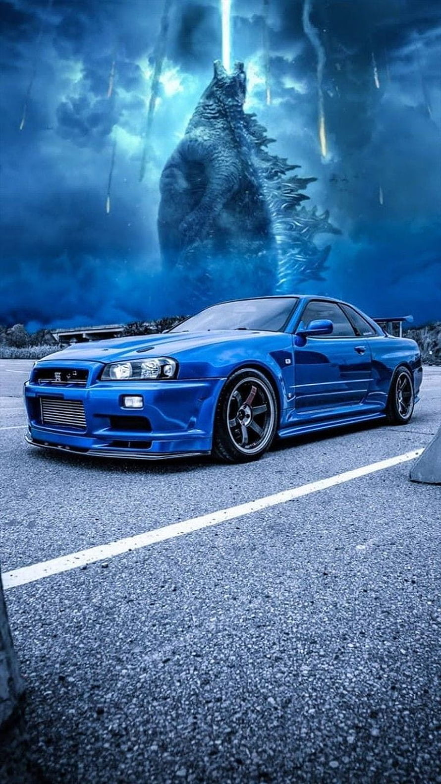 Blue Nissan Skyline R34 GT-R with Godzilla Roaring in Stormy Background HD phone wallpaper