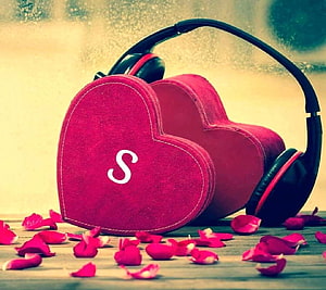 Heart-Shaped Headphones with Rose Petals on Wooden Surface HD wallpaper