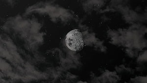 Gibbous Moon Illuminated Against a Starry Night Sky with Wispy Clouds HD wallpaper