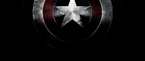 Captain America Shield Emblem on Dark Background HD wallpaper