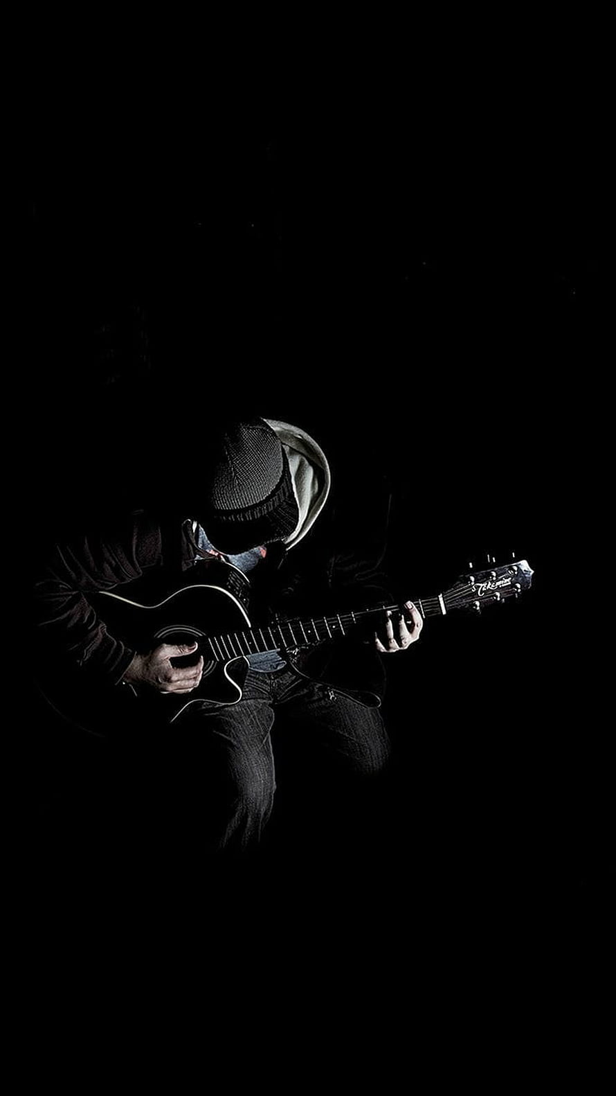Moody Musician Playing Acoustic Guitar in Dramatic Low-Key Lighting HD phone wallpaper
