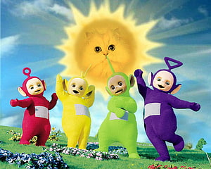 Teletubbies Characters Dancing on a Flower Meadow Under a Sun with a Cat Face HD wallpaper