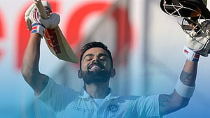 Virat Kohli Celebrating Cricket Victory With Bat And Helmet Raised High HD wallpaper
