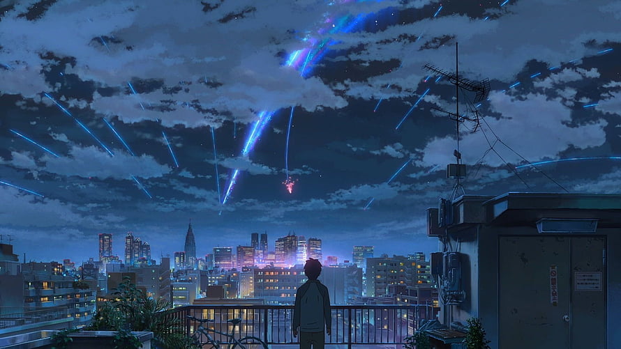 Anime boy watching blue meteor shower over city skyline at night HD wallpaper