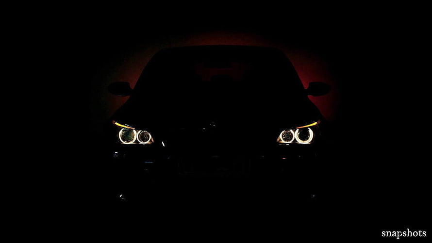 BMW M5 E60 Front Headlights Glowing in Darkness with Red Ambient Light HD wallpaper