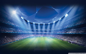 Illuminated Football Stadium Interior With Floodlights And Full Crowd HD wallpaper