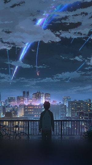 Anime Boy Watching Meteor Shower Over City Skyline at Night HD phone wallpaper