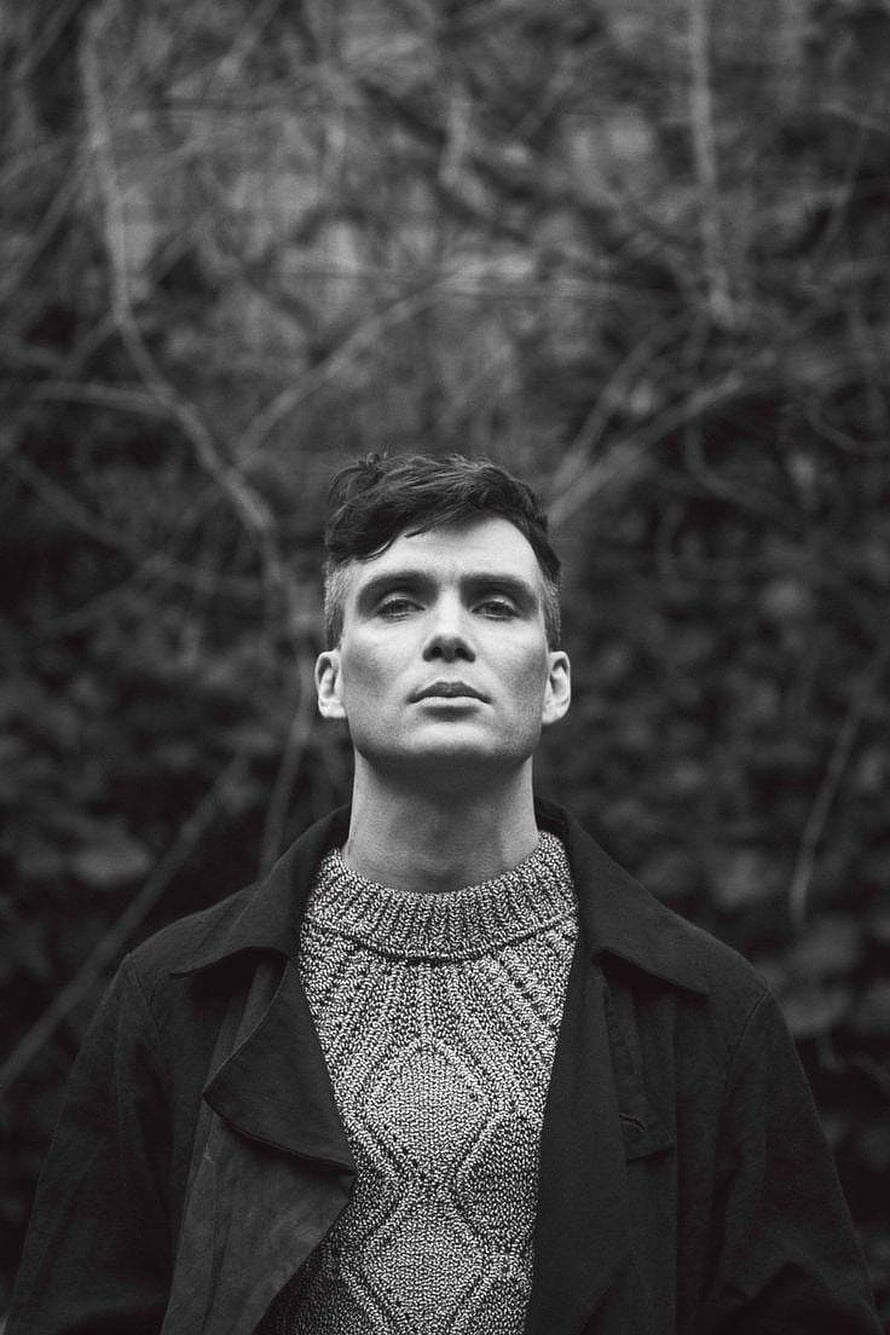 Cillian Murphy Black and White Portrait in Knit Sweater and Coat Against Forest Background HD phone wallpaper