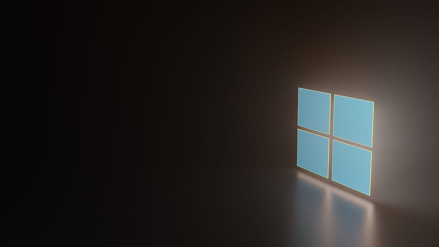 Glowing Windows 11 Logo on Dark Wall with Reflection HD wallpaper