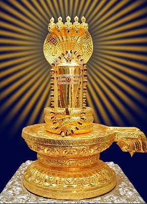 Ornate Golden Shiva Lingam with Multi-Headed Cobra Hood and Radiant Sunburst Background HD phone wallpaper