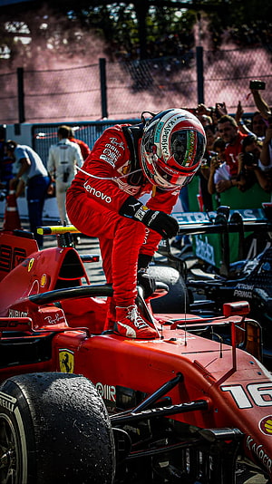 Charles Leclerc Climbing Into Ferrari F1 Car During Race Weekend HD phone wallpaper