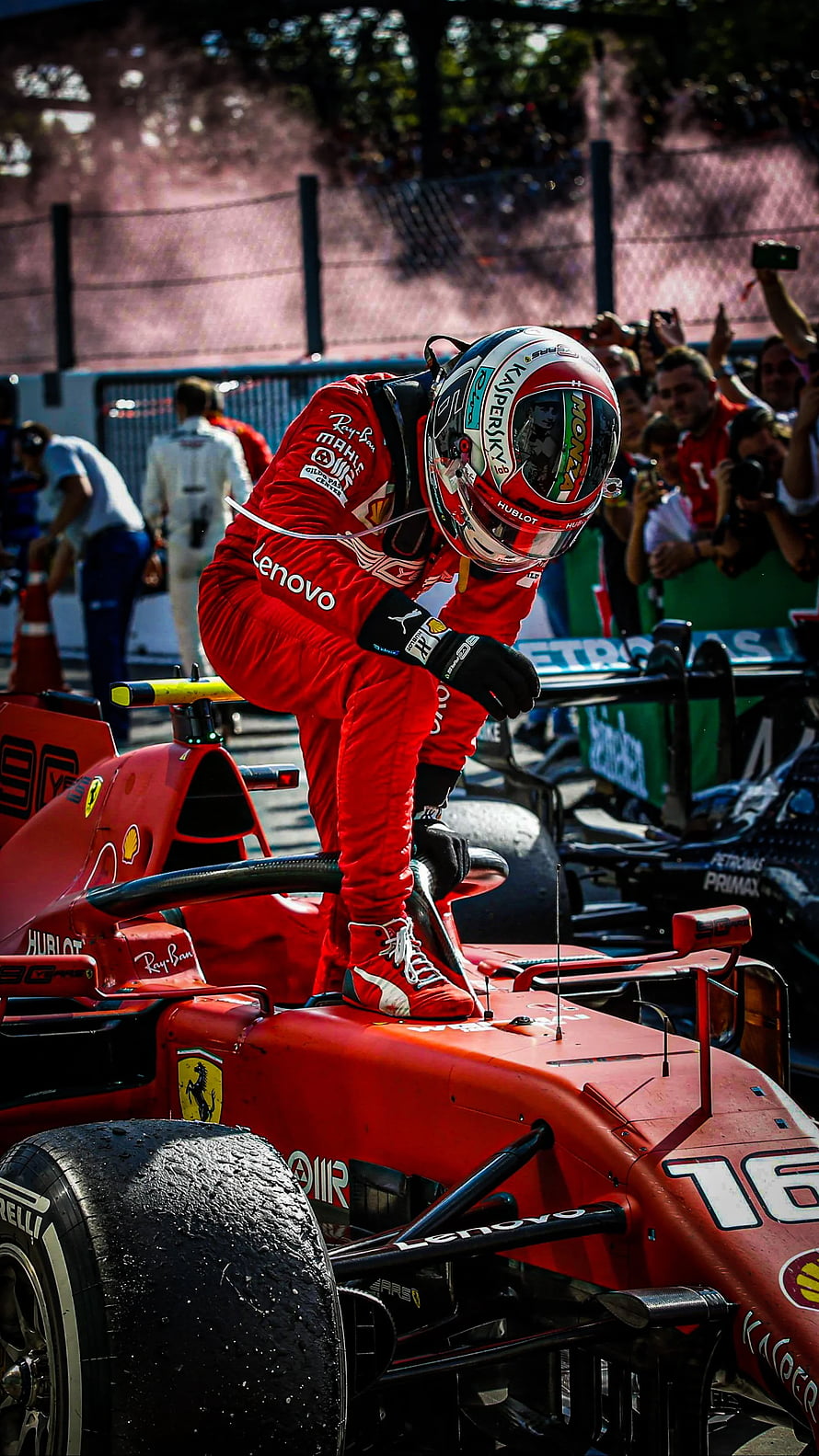 Charles Leclerc Climbing Into Ferrari F1 Car During Race Weekend HD phone wallpaper