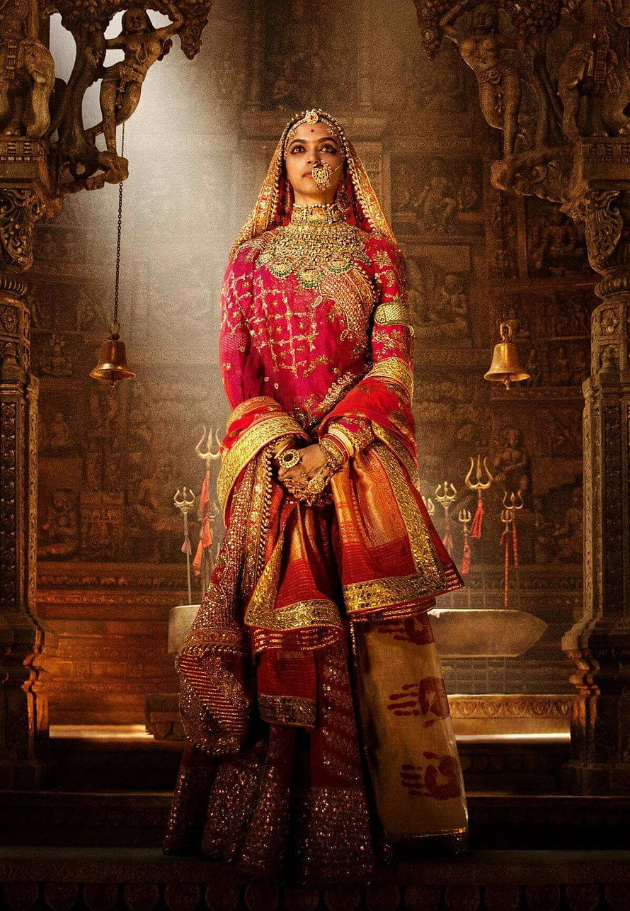 Deepika Padukone as Padmavati in ornate red bridal attire within a grand temple setting HD phone wallpaper