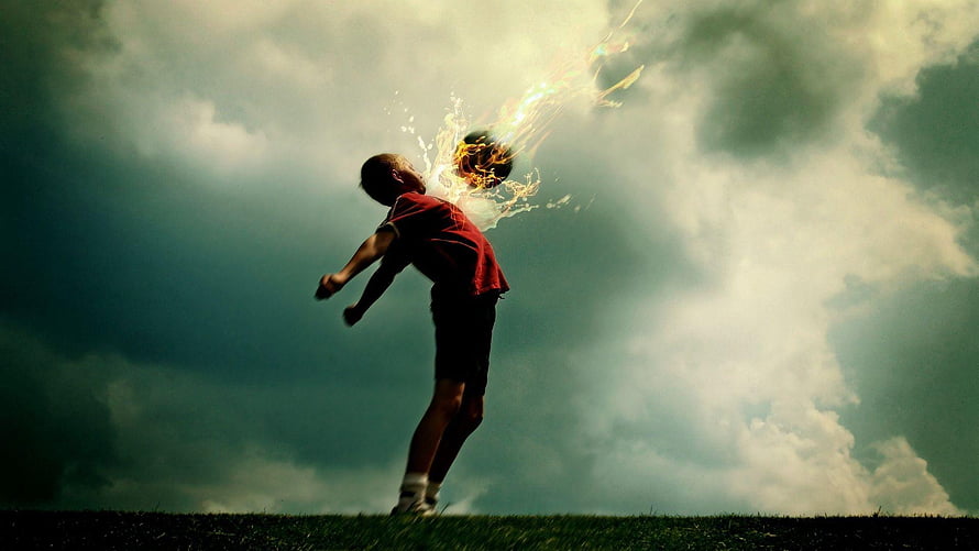 Dramatic Soccer Player Silhouette Kicking Ball Against Stormy Sky HD wallpaper