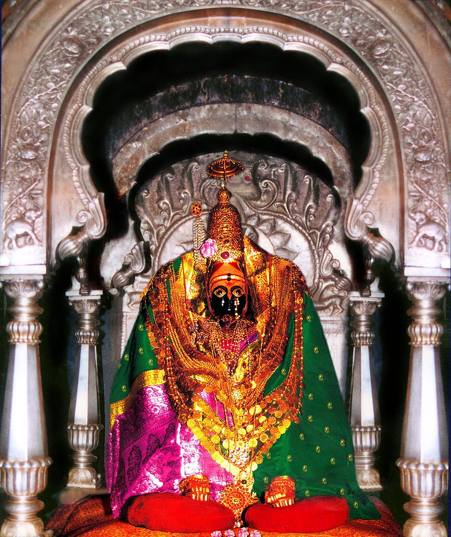 Ornate Hindu Deity Statue Adorned in Gold Jewelry and Green Silk Garments HD phone wallpaper