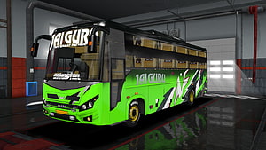 Green and Black Custom Coach Bus with Jai Guru Livery in Garage HD wallpaper