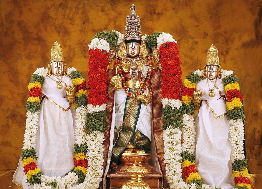 Hindu Deities Adorned in White Silk and Flower Garlands HD wallpaper