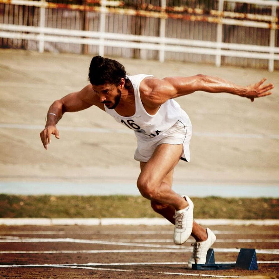 Milkha Singh Sprinting on Track in White Athletic Uniform HD phone wallpaper