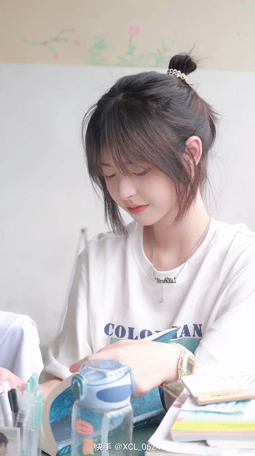 Justina Xie Studying at Desk with Books and Water Bottle HD phone wallpaper