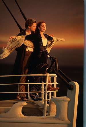 Jack and Rose at the bow of the ship during sunset in Titanic movie HD phone wallpaper