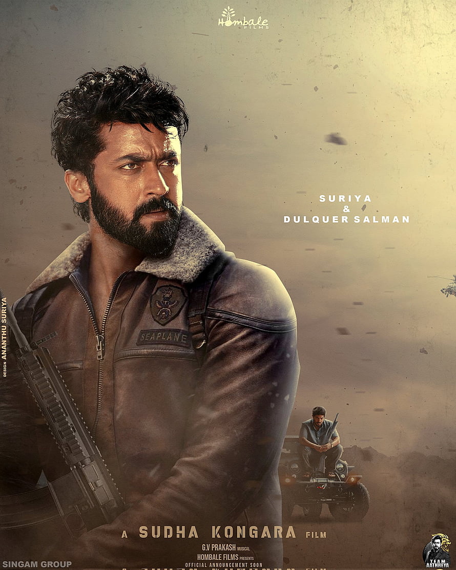 Suriya in military flight jacket with rifle in dusty action scene HD phone wallpaper