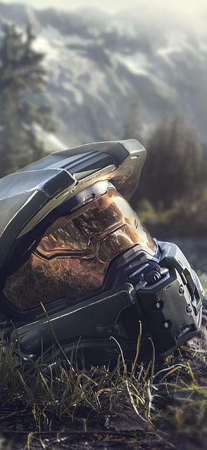 Halo Infinite Master Chief Helmet Resting in Mountain Grass HD phone wallpaper