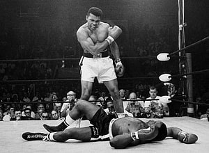 Muhammad Ali Standing Over Fallen Opponent in Historic Boxing Match HD wallpaper
