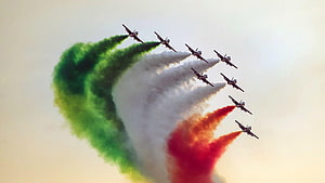 Indian Air Force jets fly in formation trailing green white and red smoke HD wallpaper