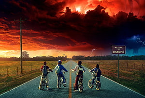 Stranger Things Season 3 Four Boys Riding Bikes on Hawkins Road Under Dramatic Stormy Sky HD wallpaper