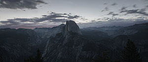 Half Dome at Dusk in Yosemite National Park with Dramatic Clouds and Valley Mist HD wallpaper