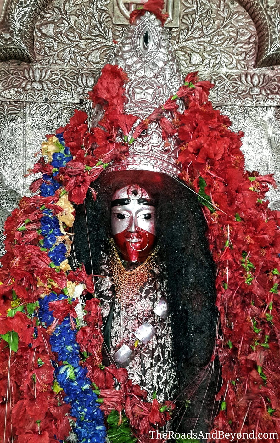 Kali Ma Hindu Goddess Statue Adorned With Red Hibiscus Flowers And Silver Crown HD phone wallpaper