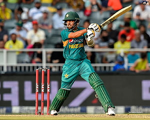 Babar Azam in Pakistan ODI kit executing a powerful cricket shot at the crease HD wallpaper