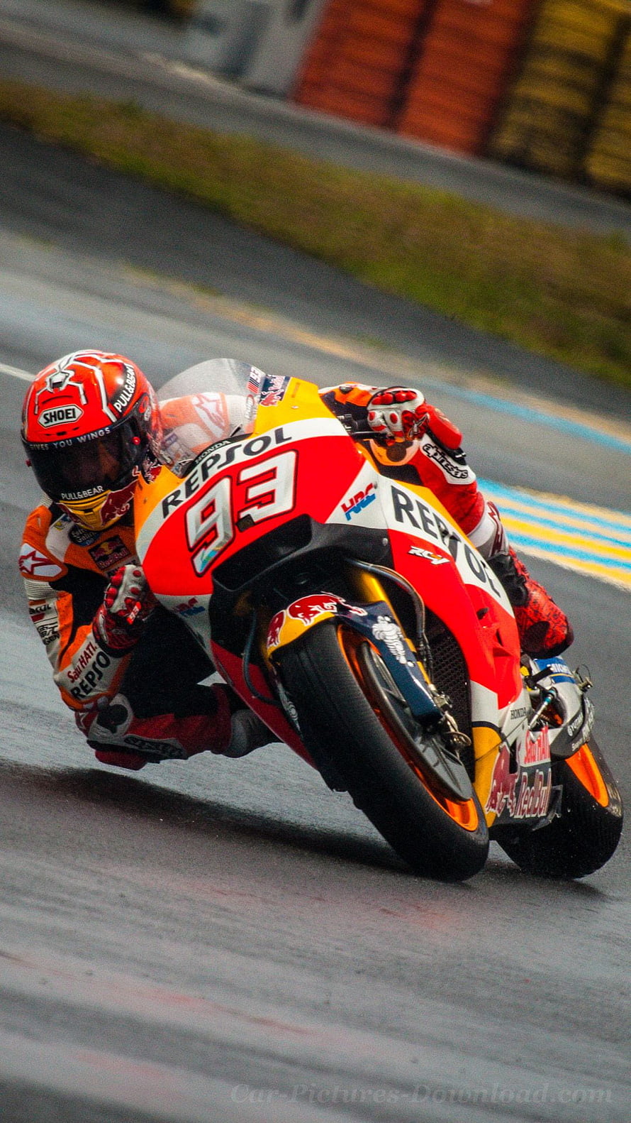 MotoGP Rider Leaning Into Corner on Repsol Honda Racing Motorcycle HD phone wallpaper