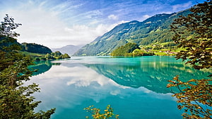 Serene Alpine Lake with Turquoise Water and Mountain Reflections HD wallpaper