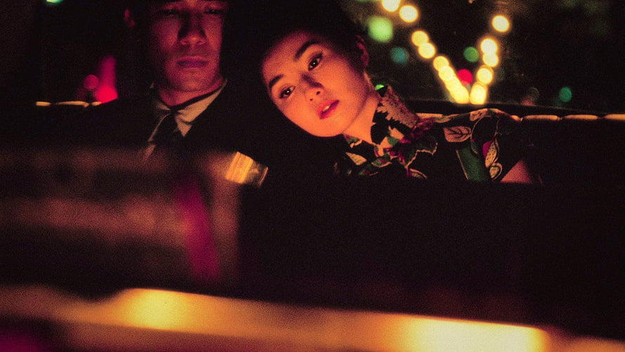 In the Mood for Love cinematic still with Wong Kar-wai's signature neon-lit night scene HD wallpaper