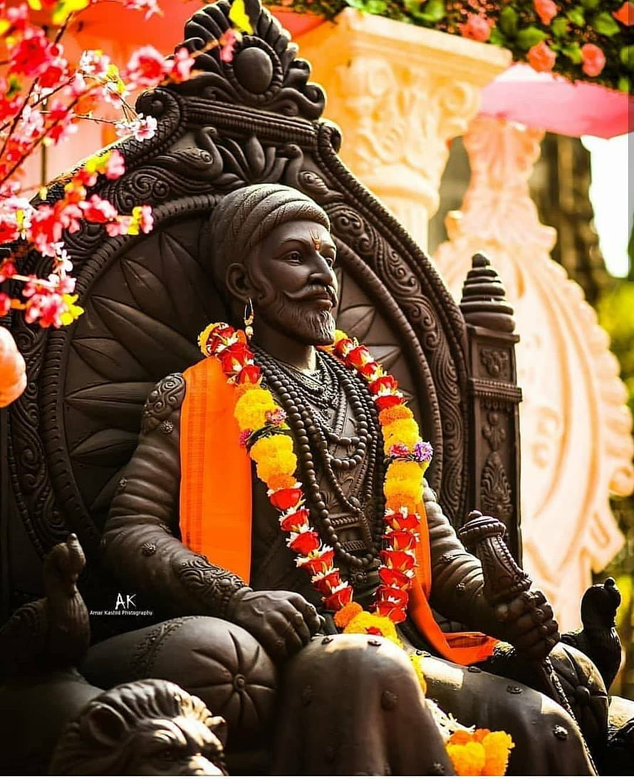Shivaji Maharaj Statue Adorned With Marigold Garlands and Orange Saffron Cloth HD phone wallpaper