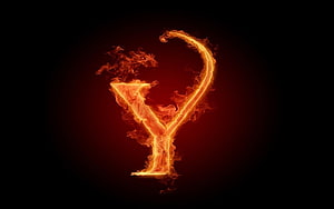 Flaming Letter Y with Rising Smoke on a Dark Background HD wallpaper