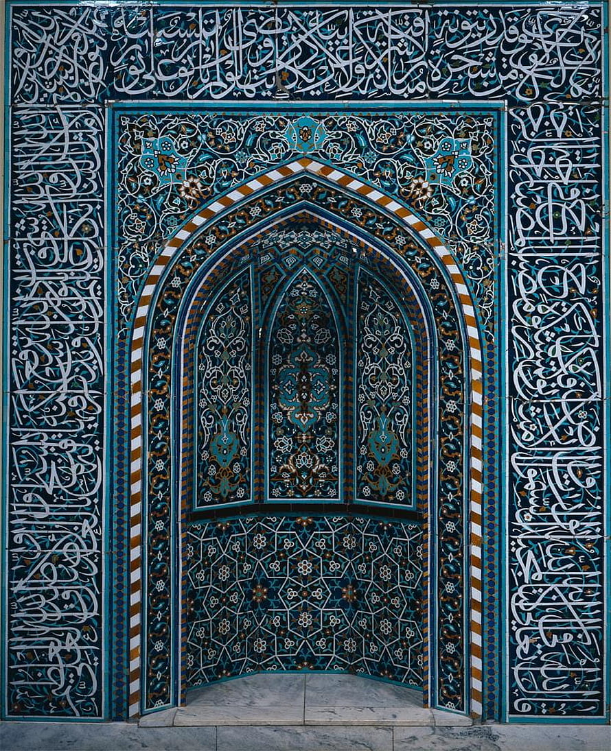 Intricate Islamic Archway with Blue Zellige Tilework and Arabic Calligraphy HD phone wallpaper