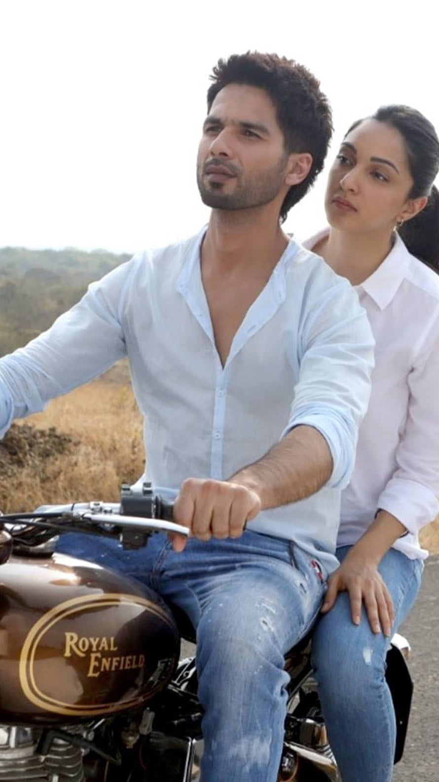 Shahid Kapoor and Deepika Padukone Riding a Royal Enfield Motorcycle in White Shirts HD phone wallpaper