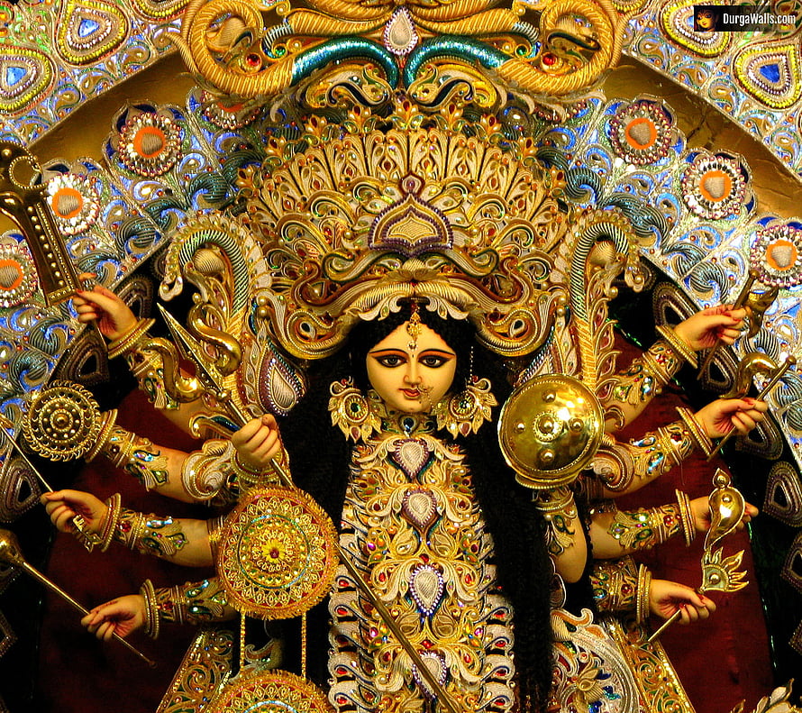 Ornate Golden Idol of Goddess Durga with Multiple Arms Holding Weapons and Shields HD wallpaper