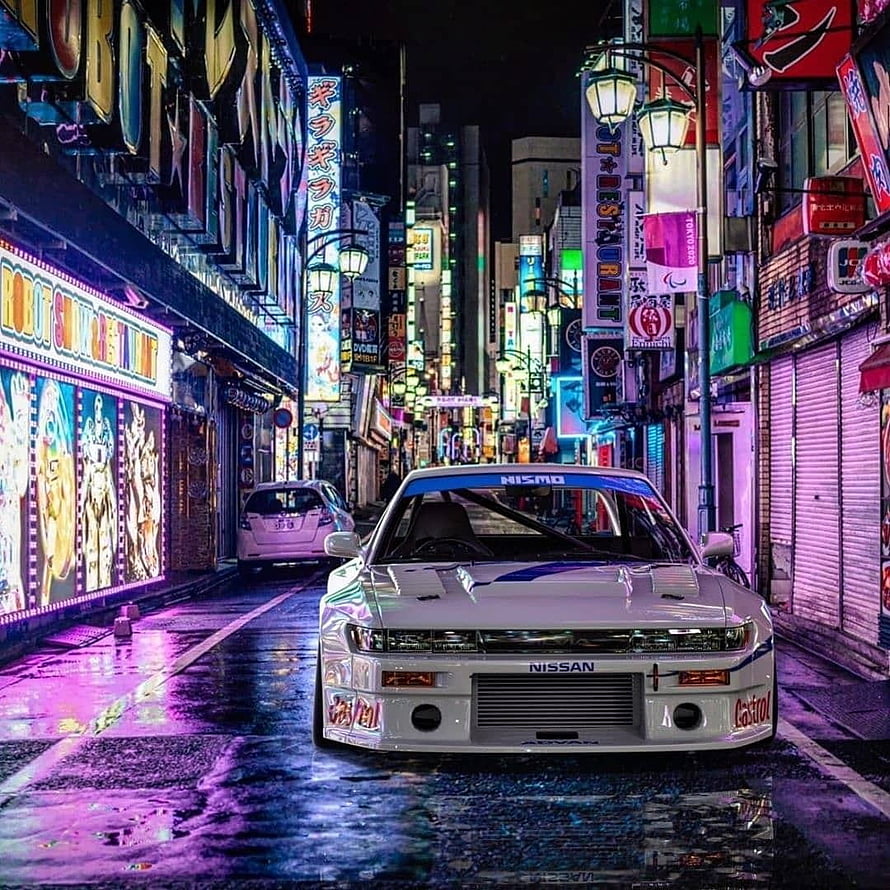 White Nissan Skyline GT-R R32 Nismo in Neon-Lit Tokyo Street at Night HD phone wallpaper